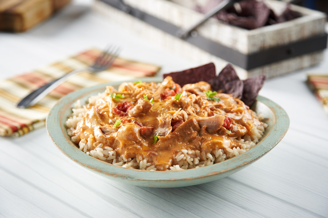Chicken Queso served over rice
